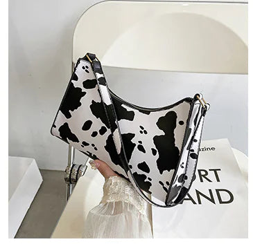 Chic Cow Print Baguette Handbag